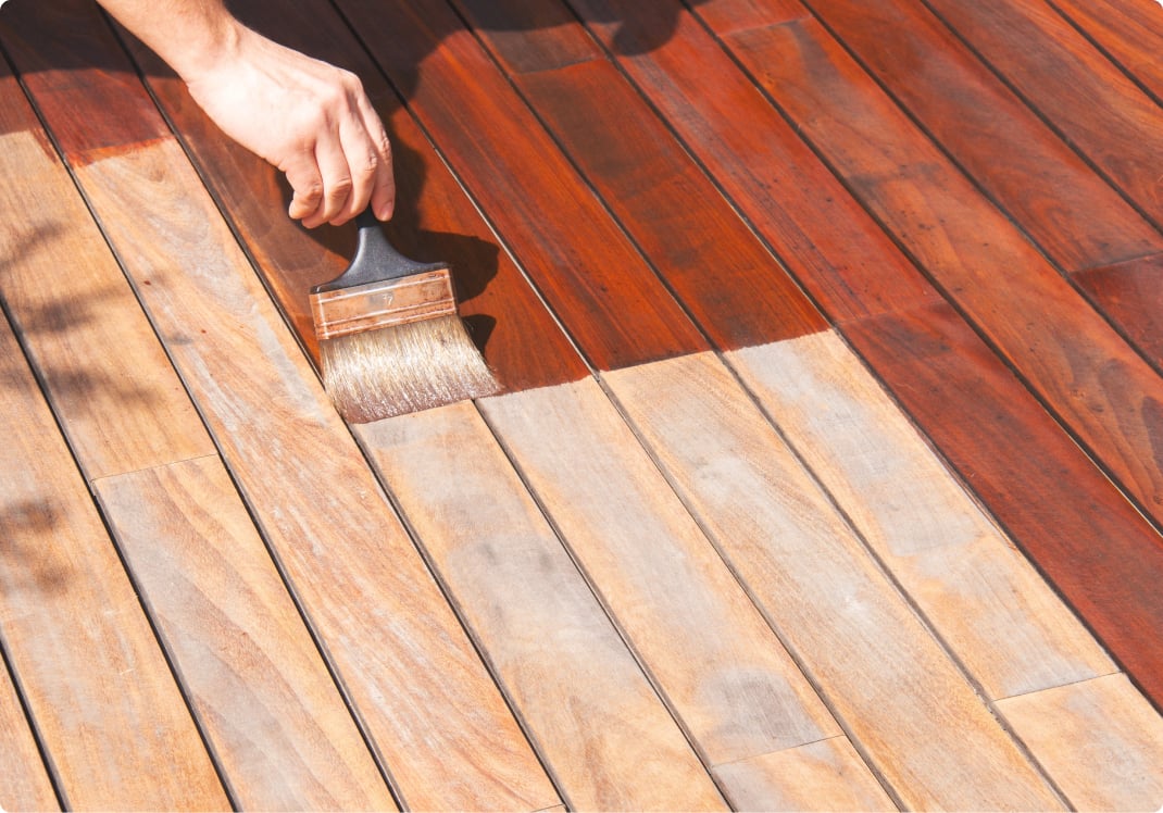 Deck-staining with a wide brush