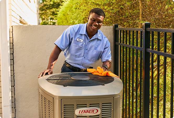 expert wiping down exterior ac unit