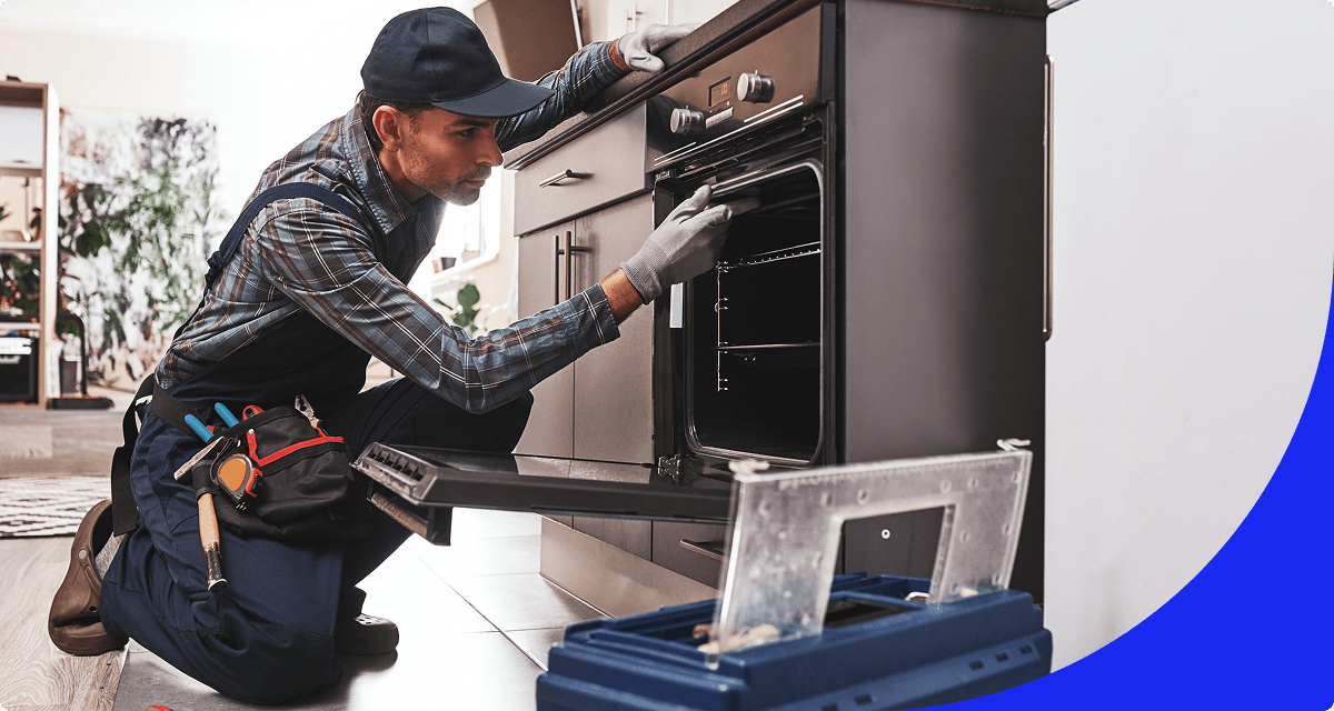 Expert performing oven maintenance